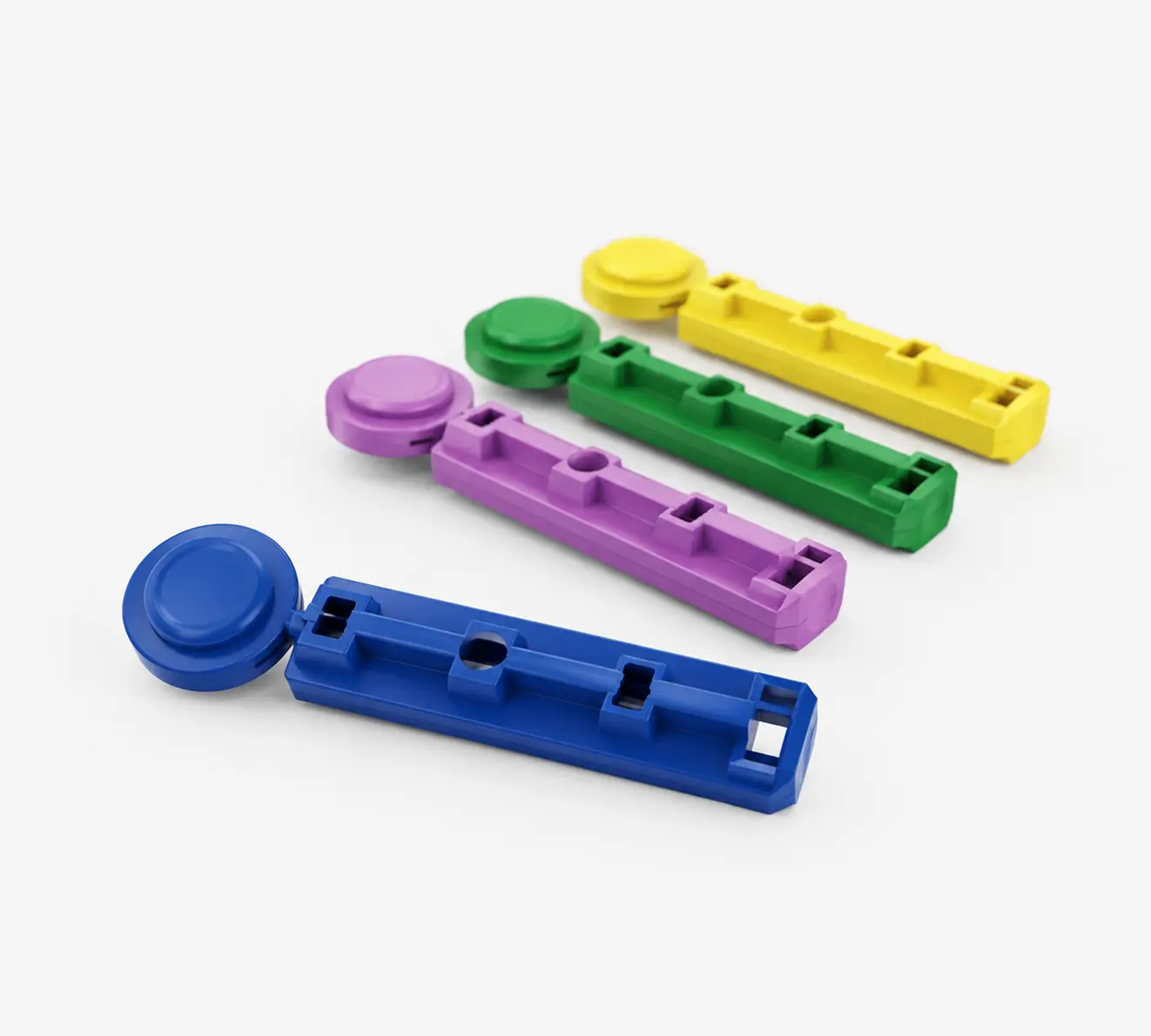 Twist-cap blood lancets in multiple color-coded gauge configurations