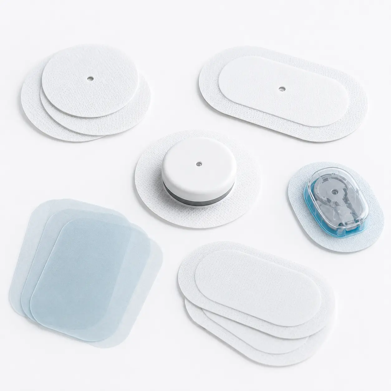 Continuous glucose monitoring sensors and sensor patch formats