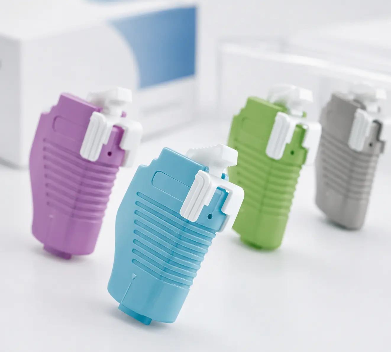 Heel blood lancets in purple, blue, green and gray configurations